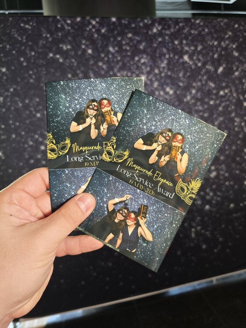 Finished 4R photobooth print with fully custom masquerade-themed border design