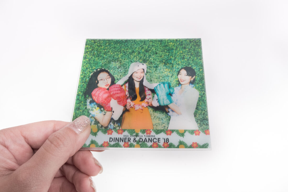The same lenticular GIF print tilted to the second angle, showing a different frame of the animation