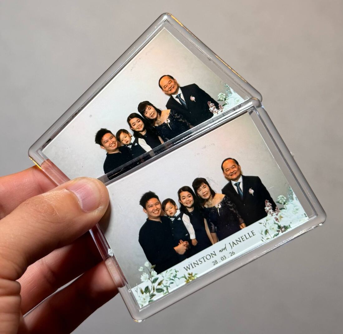Personalised acrylic photo keychain made on the spot at a Singapore event