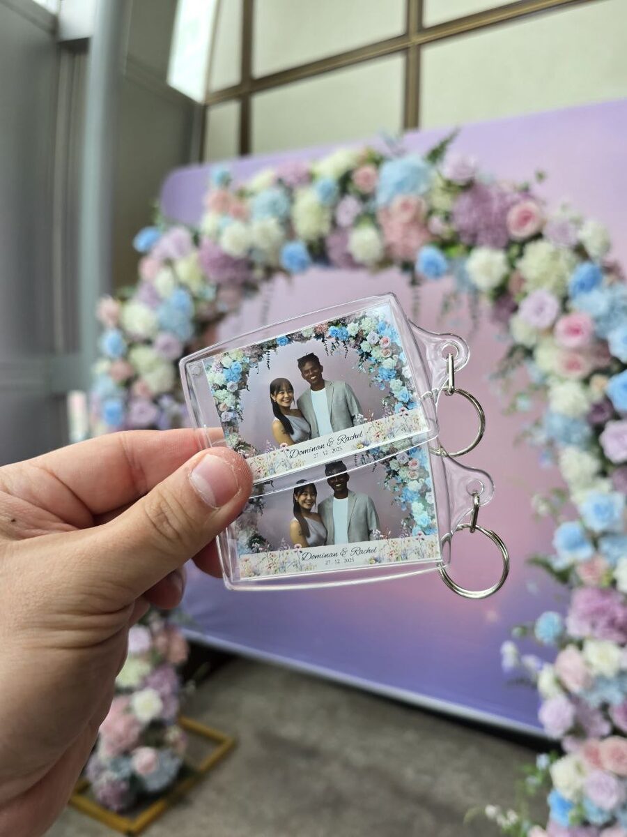 Personalised acrylic photo keychain from a Peculiar Booth wedding photobooth in Singapore